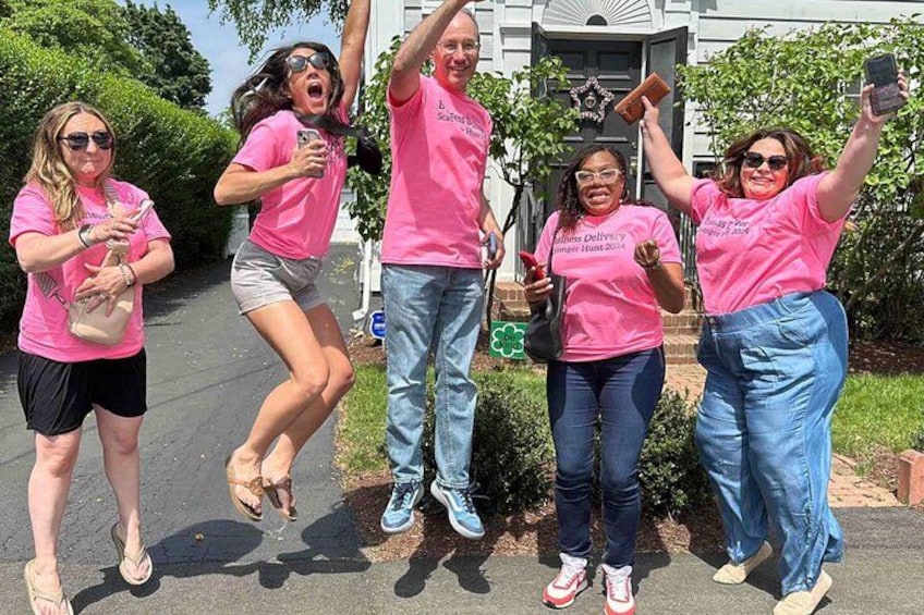 A group of people in pink shirts posing for a photo. 3