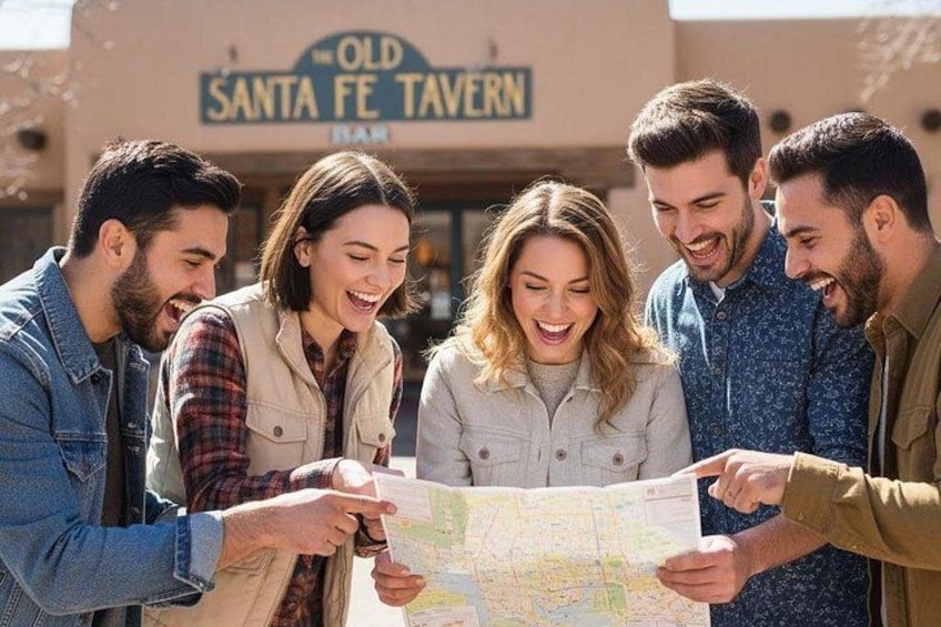 Un grupo de personas observando un mapa frente a un edificio que dice 'The Old Santa Fe Tavern'. 1