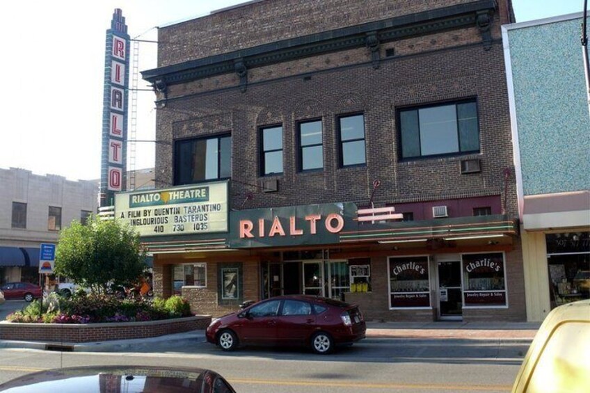 A theater named Rialto with a marquee advertising a film by Quentin Tarantino. 1