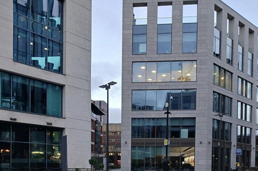 A modern building with large windows and a flat facade. 5