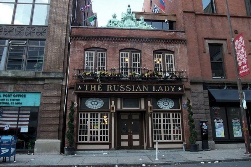 A building with a sign reading 'The Russian Lady.' 4