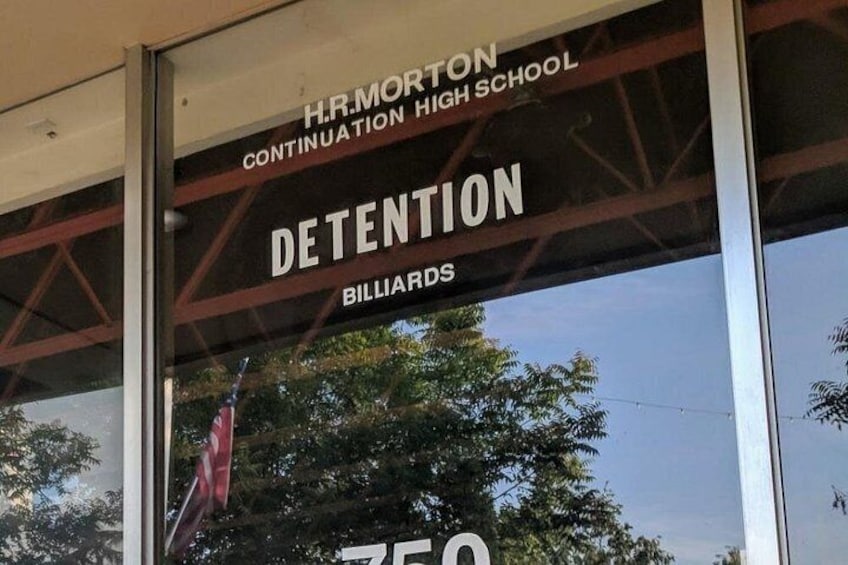 A building with a sign that reads 'H.R. Morton Continuation High School Detention Billiards.' 3