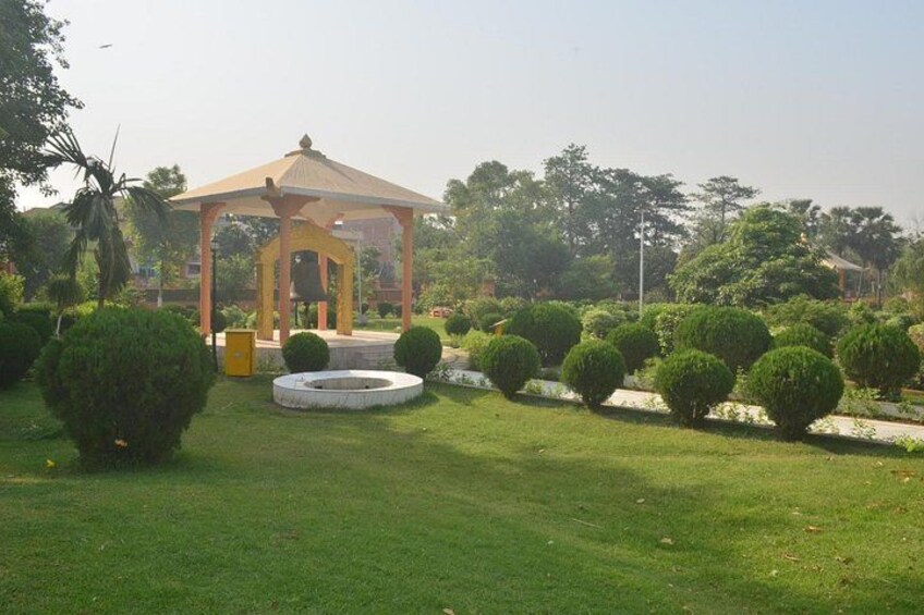 A gazebo, manicured bushes, and a well-maintained lawn. 3