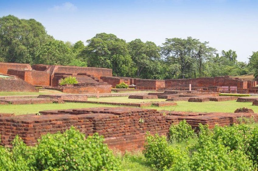 Ancient brick ruins with overgrown vegetation. 2