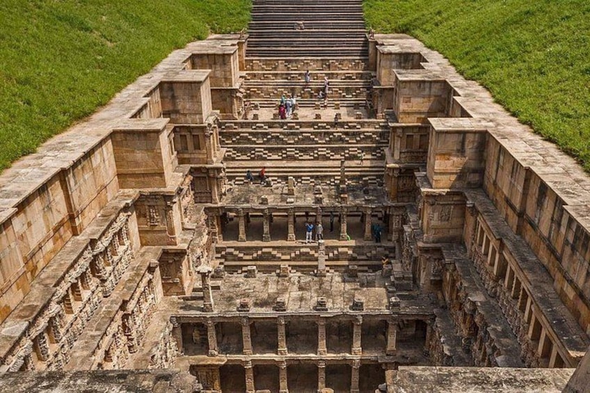 An ancient stone structure with multiple levels and staircases. 2