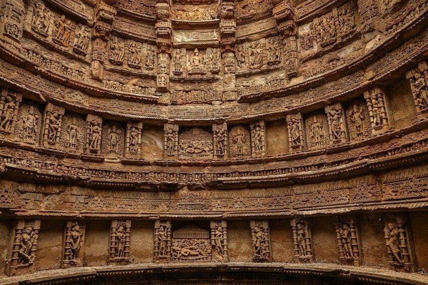 A detailed stone structure with intricate carvings and multiple levels. 3