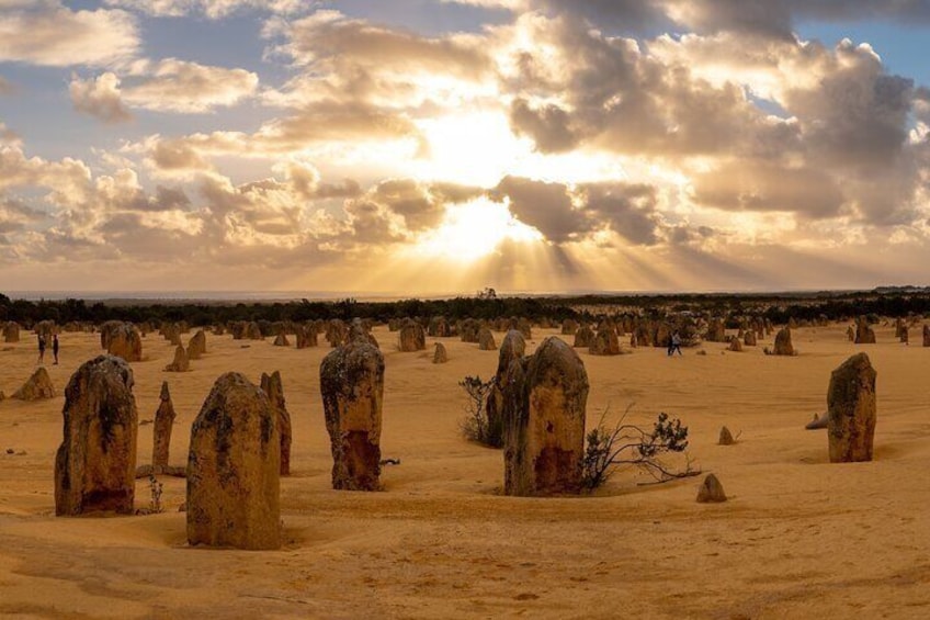 A desert landscape with numerous tall, eroded rock formations. 4