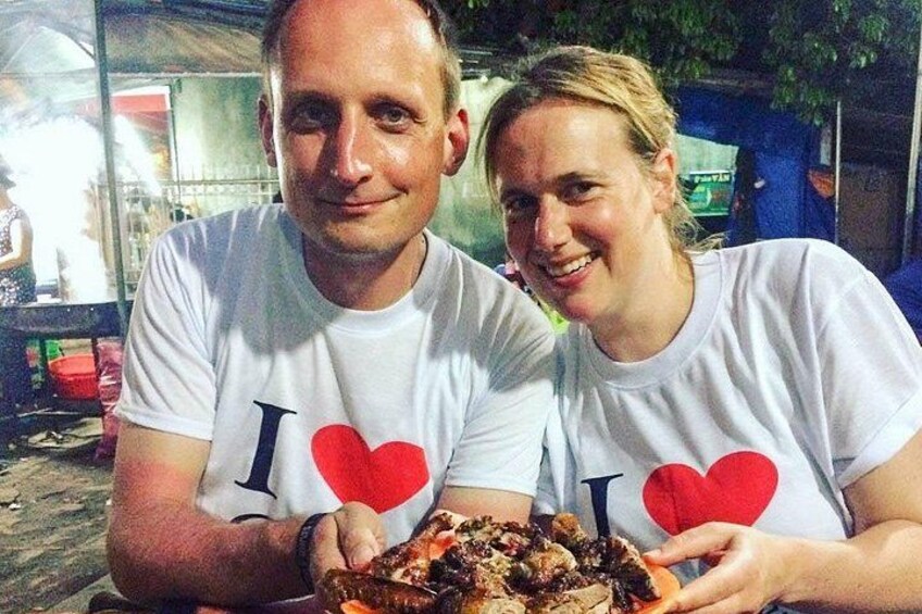 Two people wearing white t-shirts with red hearts and the text 'I ♥ U'. 2