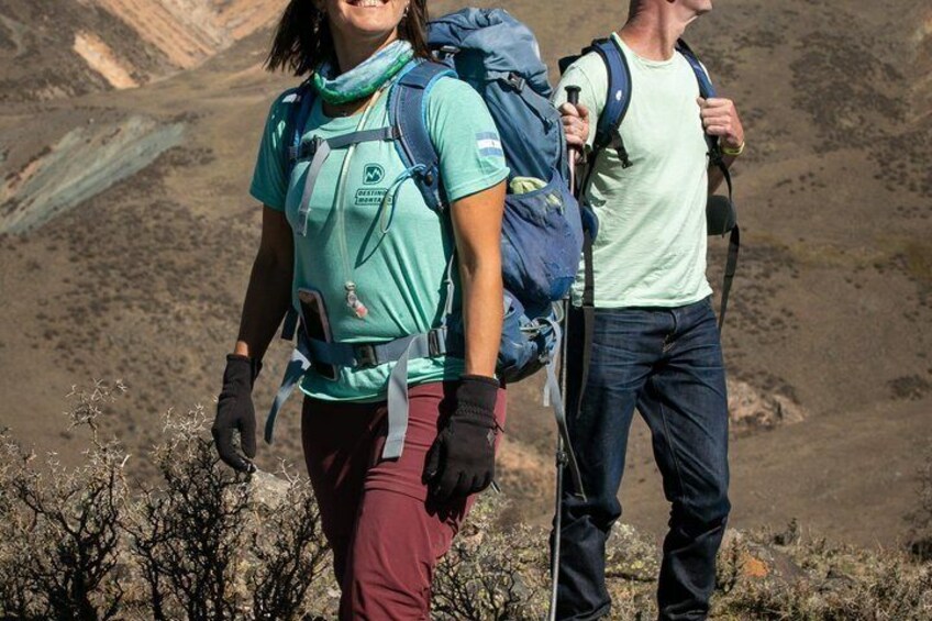 Two hikers with backpacks in a mountainous landscape. 4
