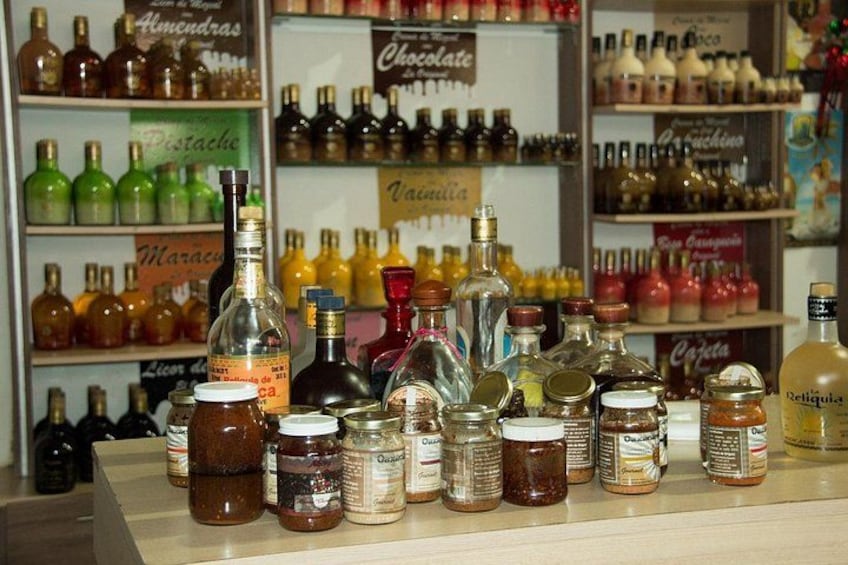 A variety of bottles and jars on shelves, likely containing alcoholic beverages and condiments. 2