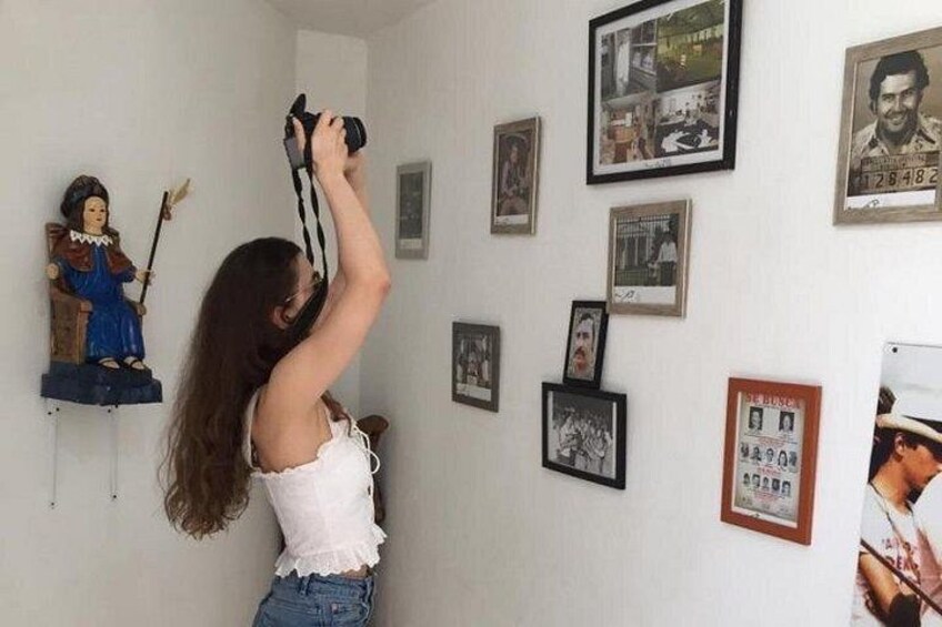 A person taking a photo with a camera. 4