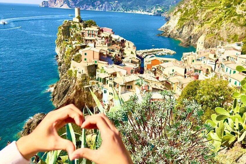 A coastal village with buildings on a cliff overlooking the sea. 1