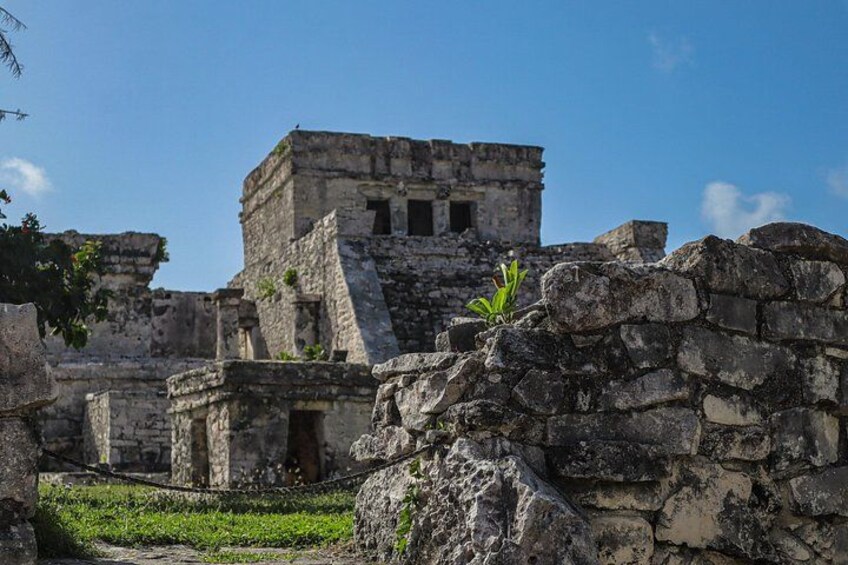 Ancient ruins with stone structures and a clear sky. 3
