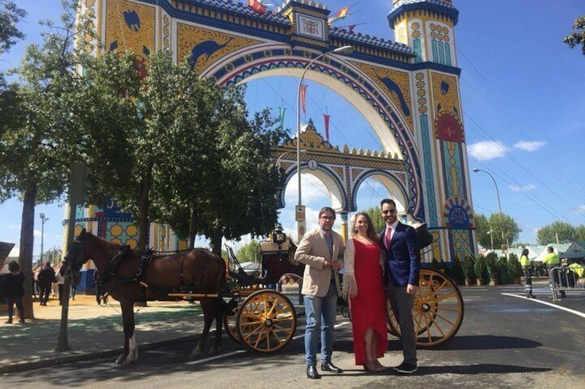 A horse-drawn carriage in front of a colorful, ornate gate. 5