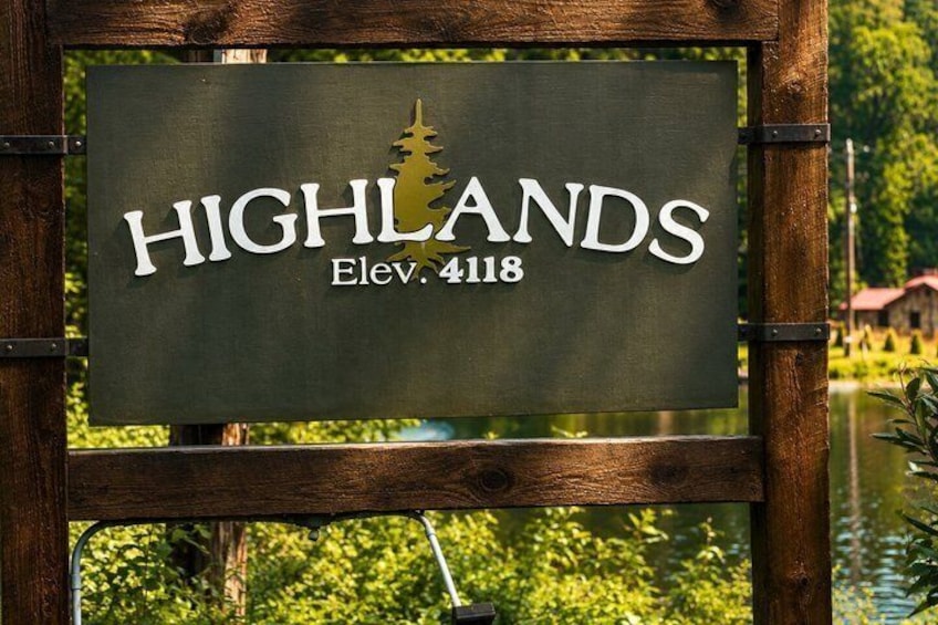 A sign with 'HIGHLANDS' and 'Elev. 4118' indicating a location. 1