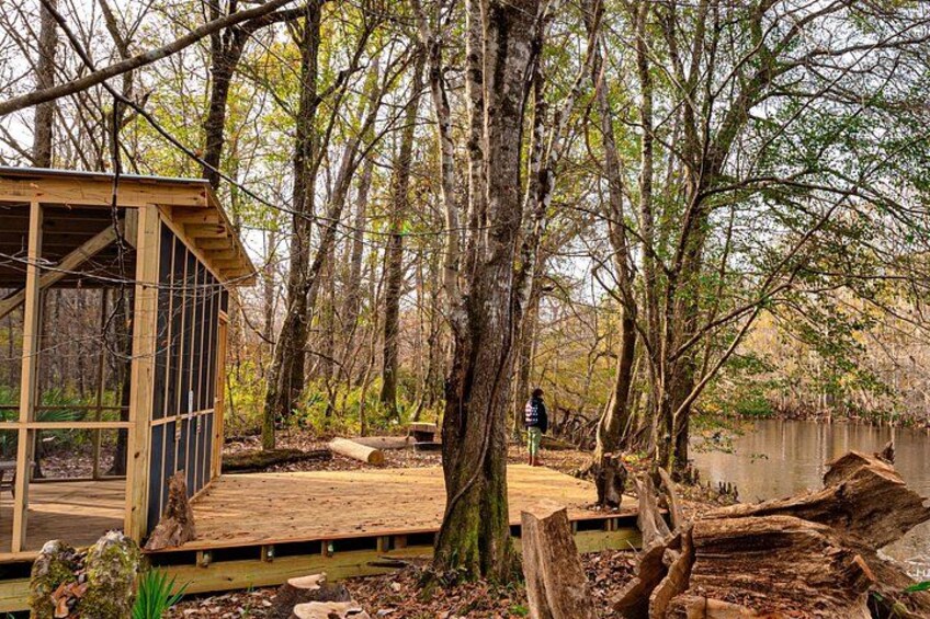 Not quite glamping, but our covered, screened-in campsite will keep you dry and comfortable. Pack a sleeping bag and plan for a quiet evening. 1
