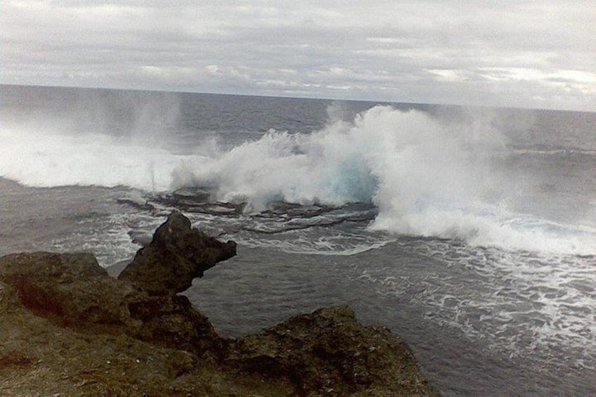 A rocky coastline with waves crashing against the rocks. 1
