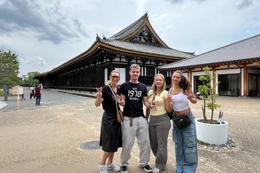 A traditional Japanese building with a tiled roof and wooden structure. 4