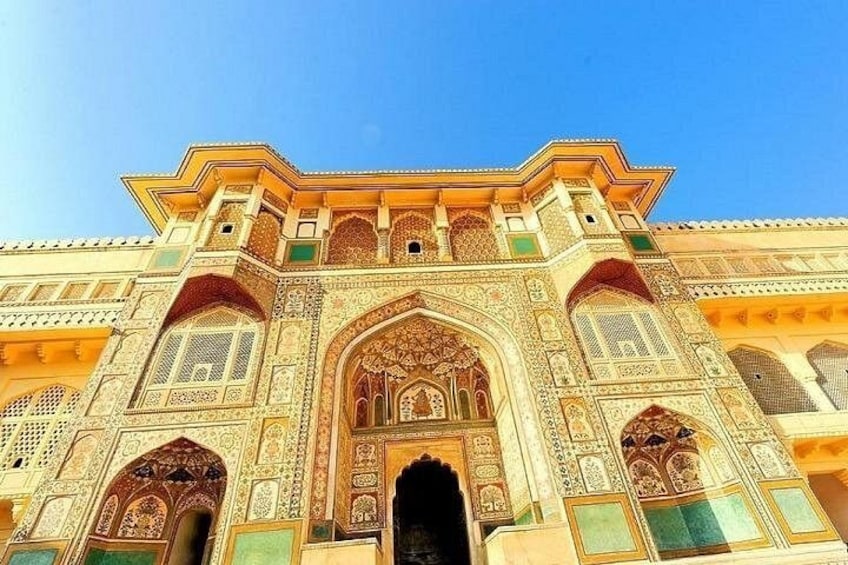 A historic building with intricate architectural details, including arches and ornate decorations. 3