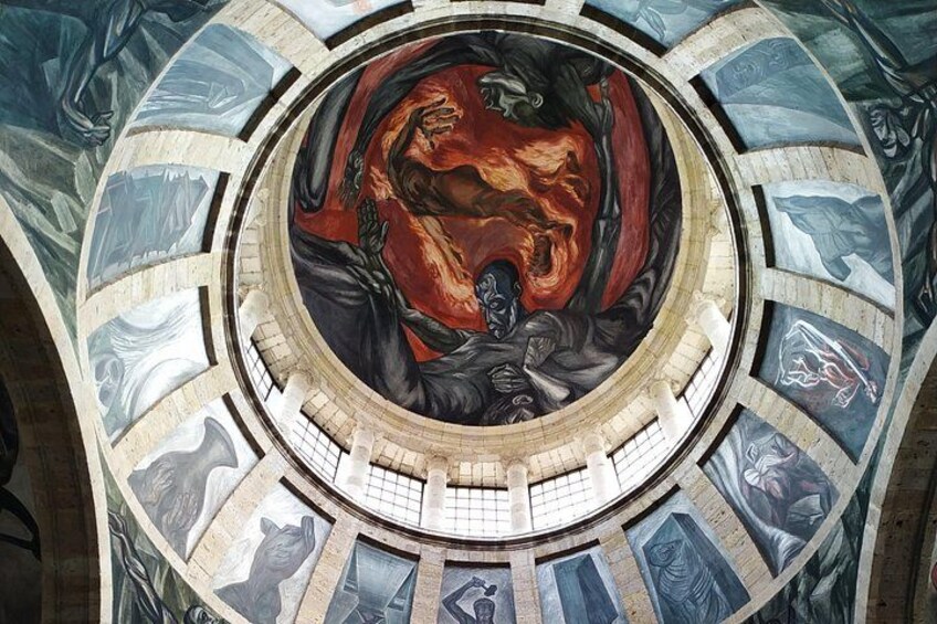 A circular fresco with a central figure surrounded by a ring of smaller figures. 3