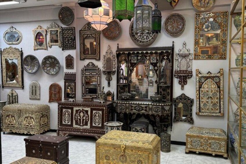 A room filled with ornate mirrors and decorative boxes. 4
