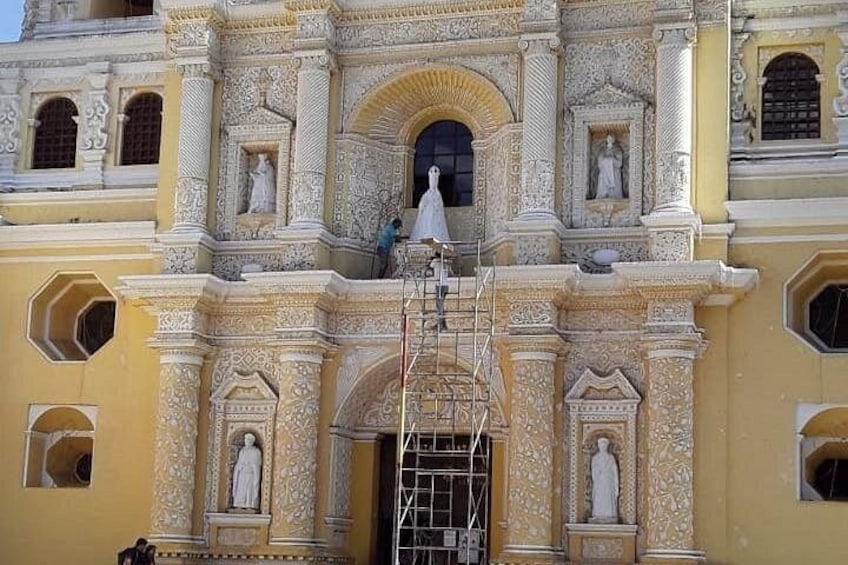 A building with ornate architectural details, including statues and intricate carvings. 1