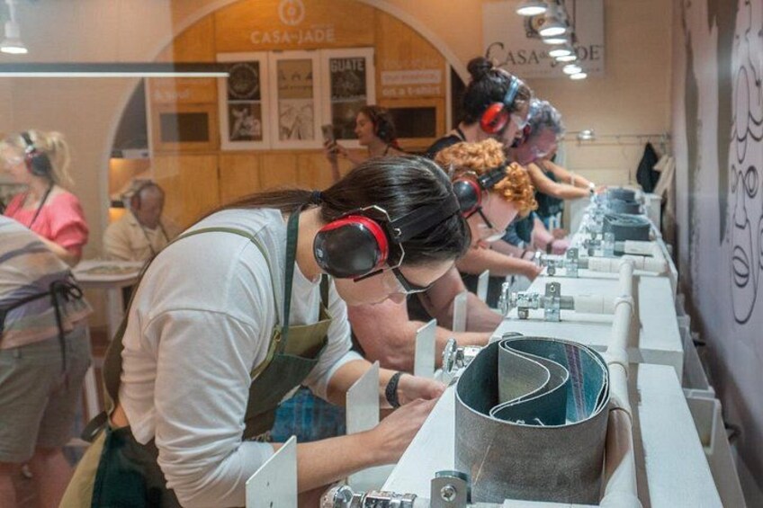 People wearing headphones and working at a counter, possibly in a cafe or restaurant. 3