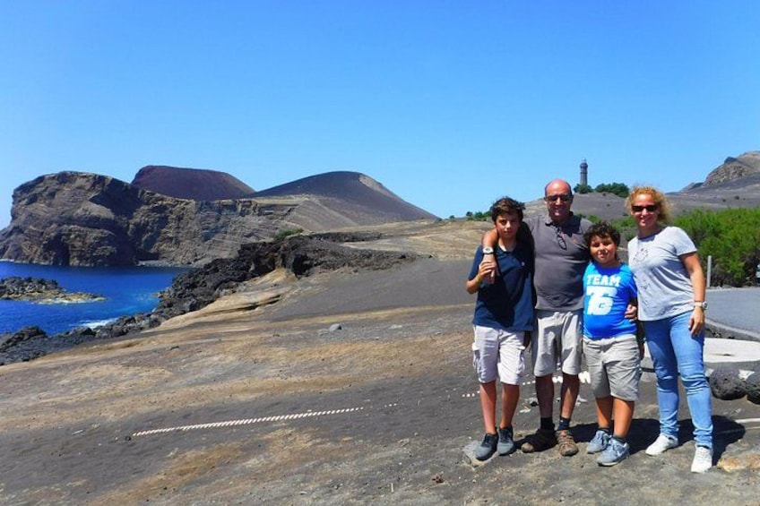 A family enjoying a beautiful sunny day at the Capelinhos Volcano. 2