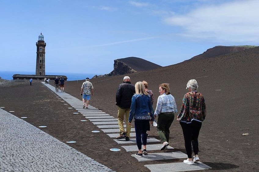 Towards the Volcano. The first floor of the lighthouse in the background is under sand and ash. 4