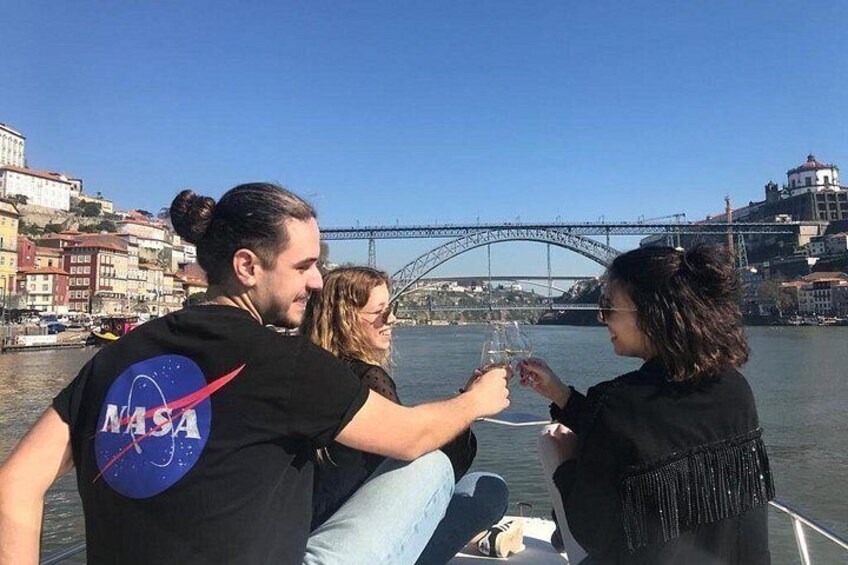 A person in a NASA t-shirt, a bridge, and a body of water. 3
