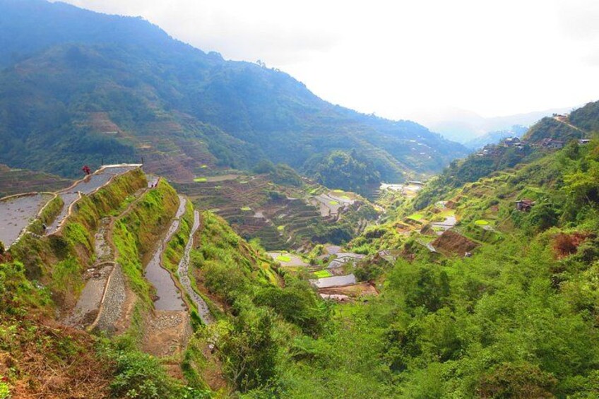 Terraced fields, a river, and a mountainous landscape. 4