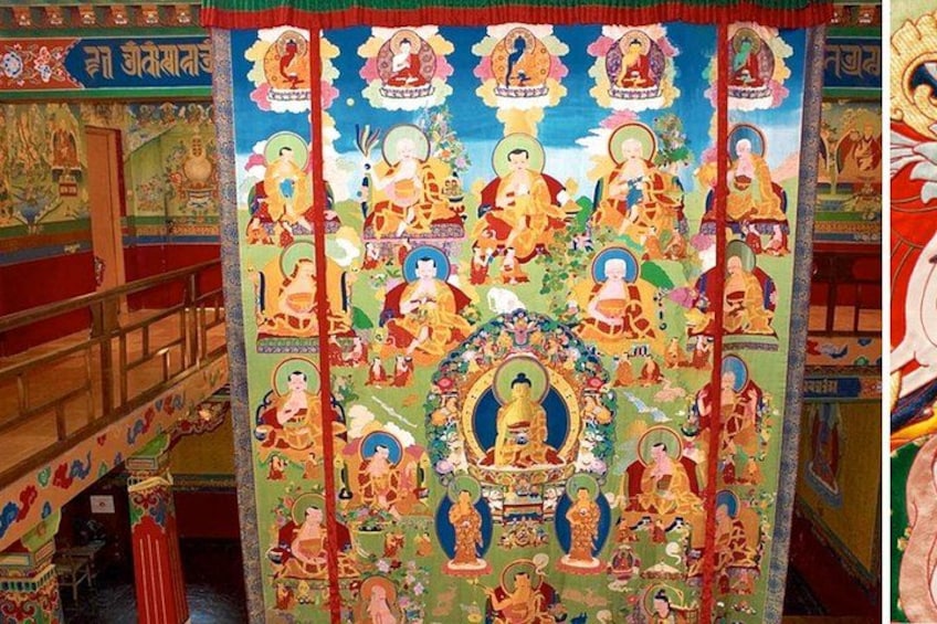 A colorful tapestry with religious figures and symbols. 3