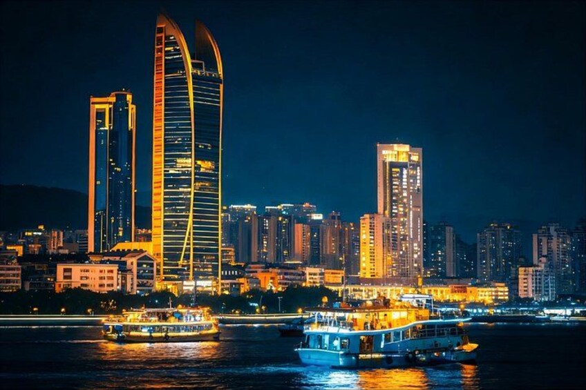 Un paisaje urbano nocturno con edificios iluminados y un río con barcos. 2