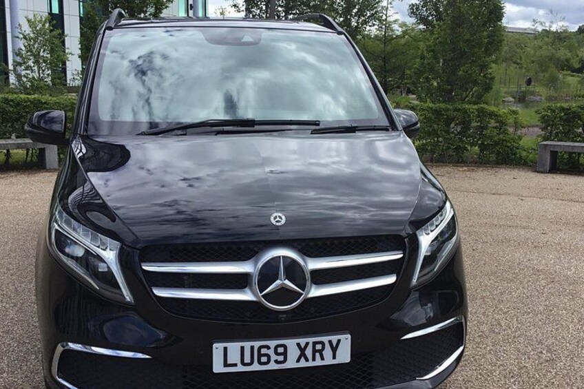 A black Mercedes-Benz SUV parked on a gravel surface with a license plate 'LU69 XRY'. 2