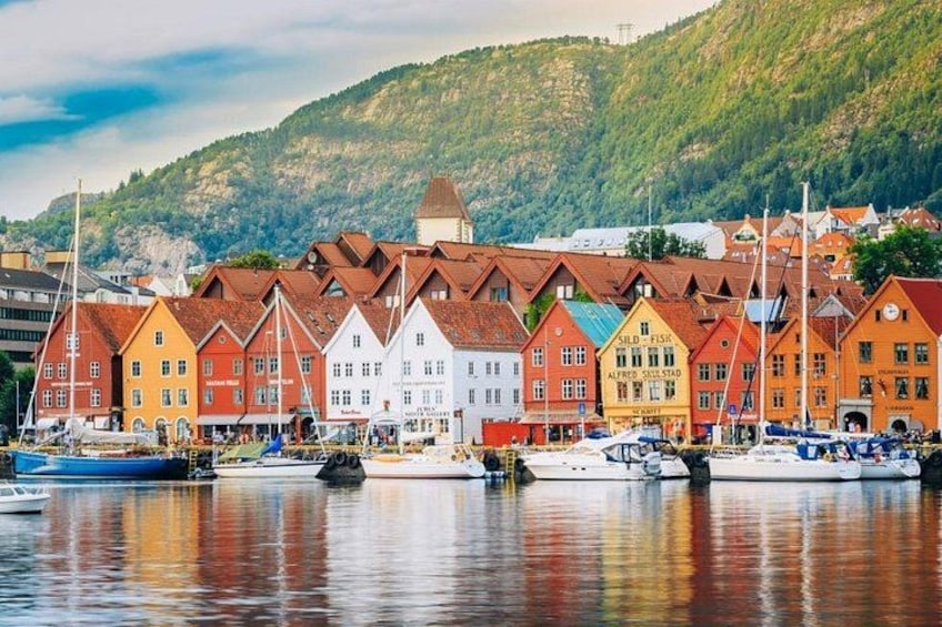 A harbor with colorful buildings and boats. 5