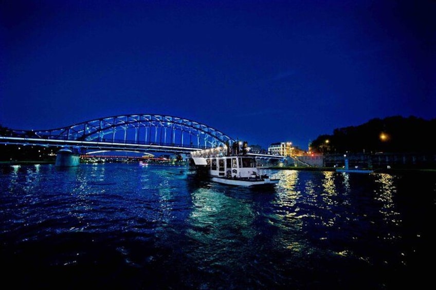 A boat on a river with a bridge in the background. 5