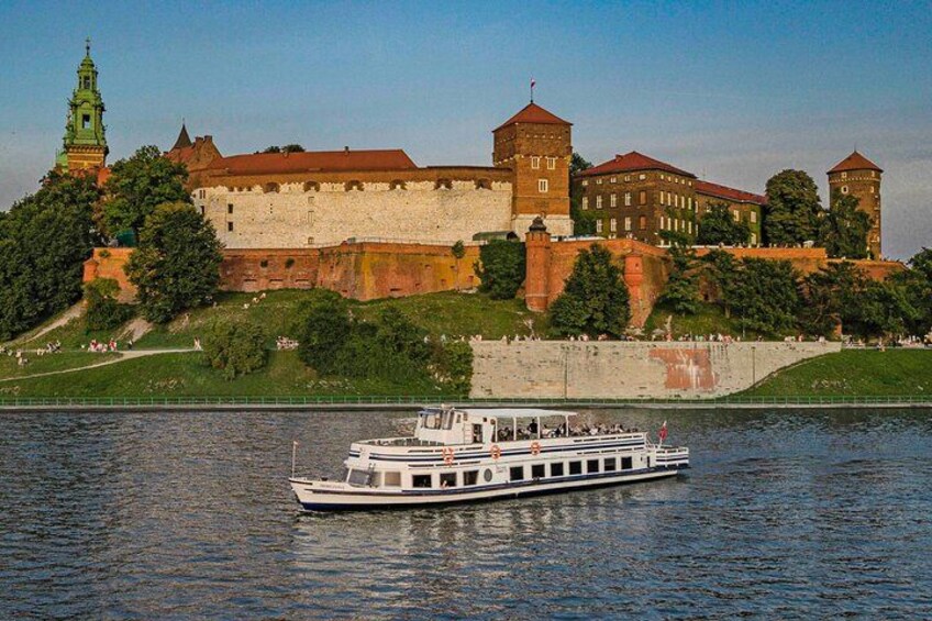 A river with a boat, a castle, and a church. 5