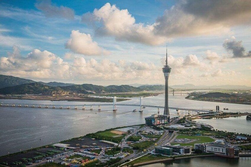 A large body of water with a prominent tower, a bridge, and surrounding buildings. 5