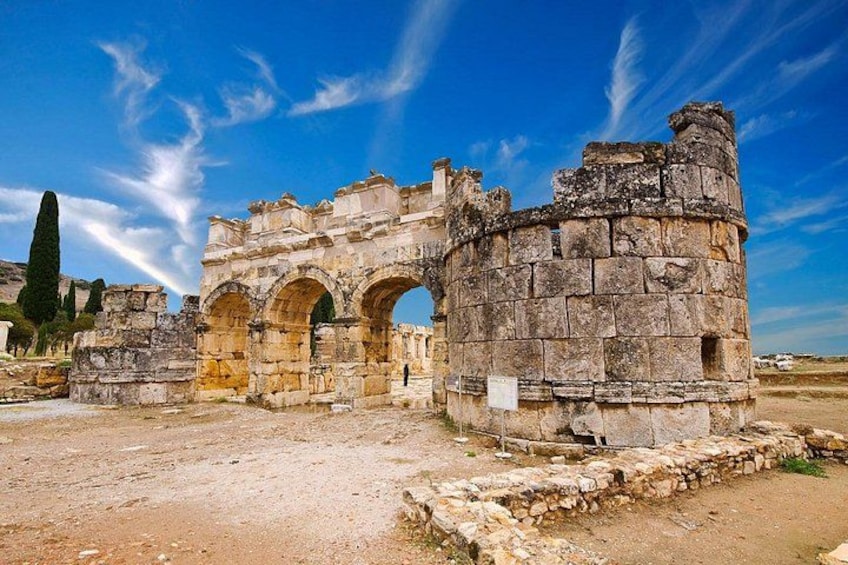 Ancient ruins with arches and stone walls. 2