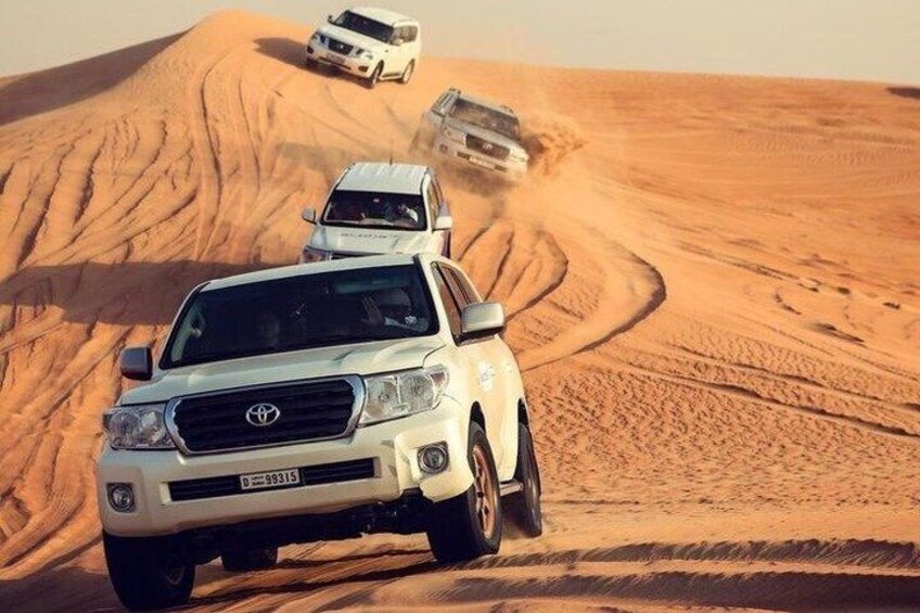 Dubai Desert Safari, Dune Bashing, Camel Ride, Sandboarding & BBQ 3