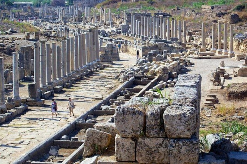Ancient ruins with columns and stone structures. 3