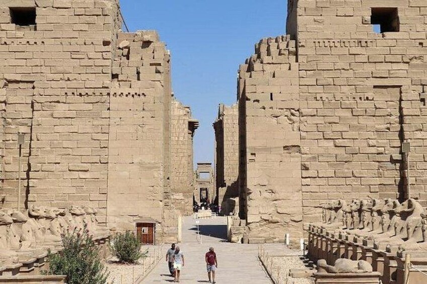 Ancient Egyptian ruins with large stone blocks and a clear sky. 4