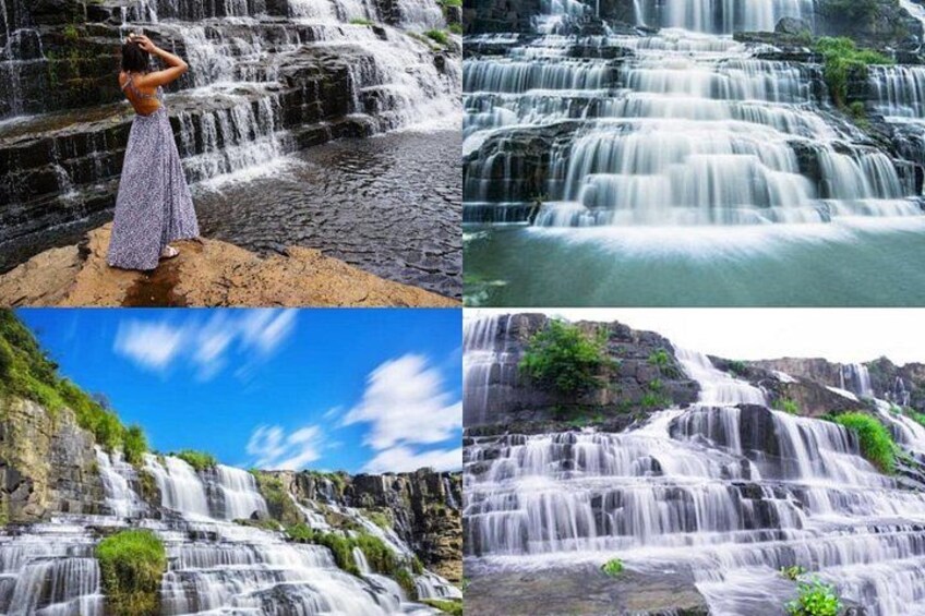 A waterfall with a person standing in front of it. 3