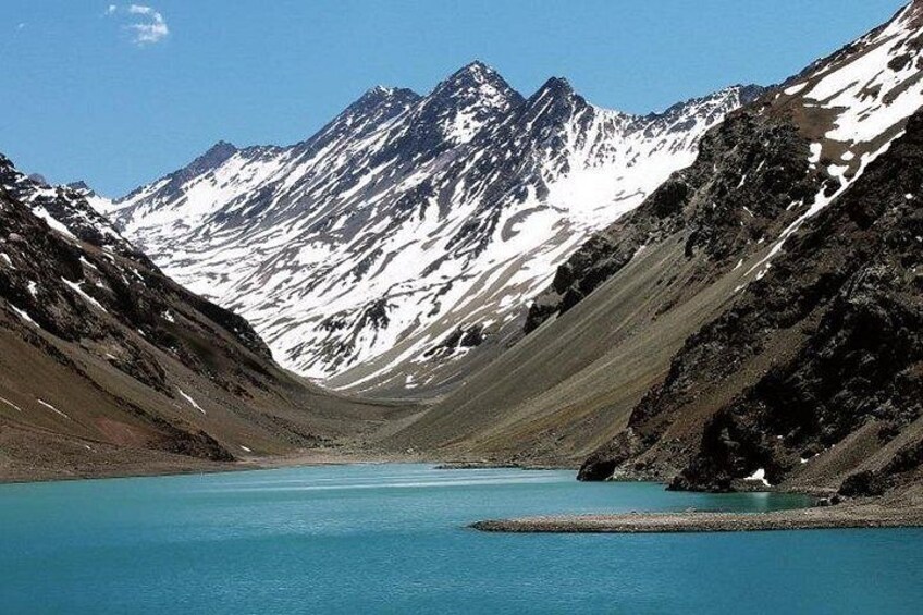 A mountain lake surrounded by snow-capped peaks. 1