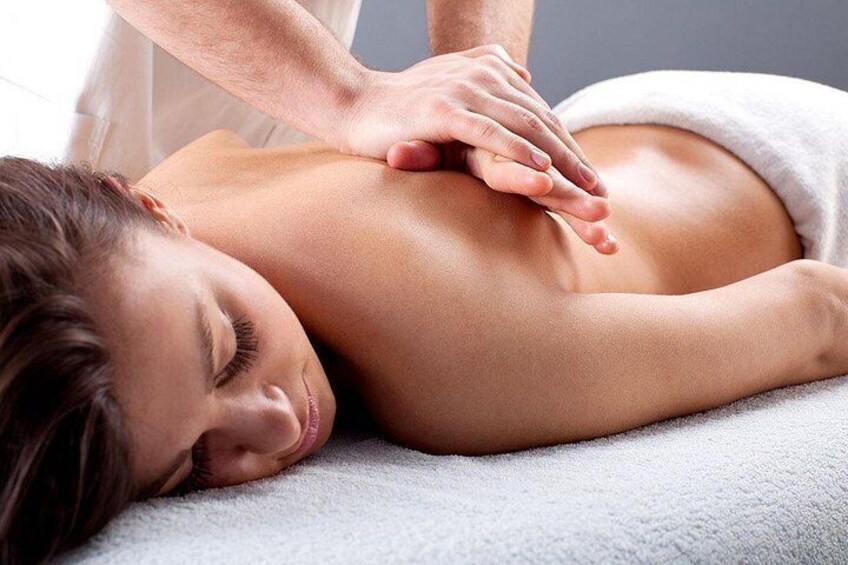 A person receiving a back massage. 5