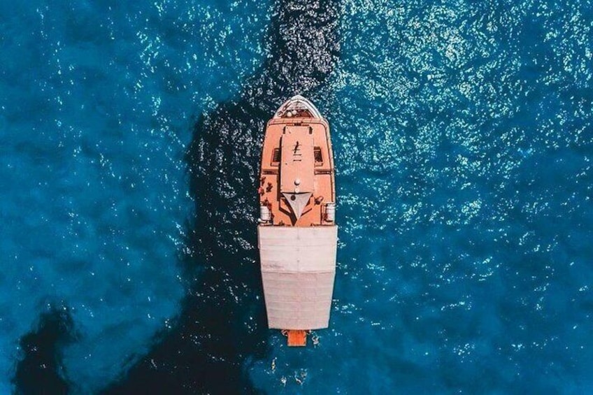 A small boat on a body of water. 1
