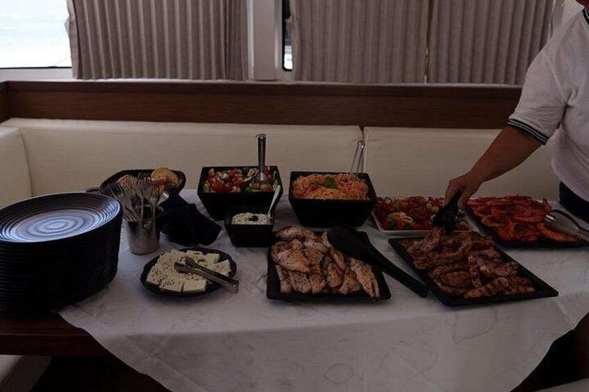 A buffet table with various dishes, including seafood, salads, and cheeses. 5