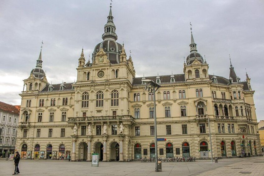 A large, ornate building with multiple spires and arched windows. 3