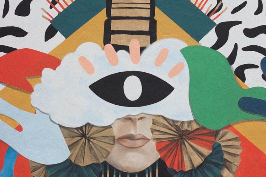 Et farverigt abstrakt maleri med et markant øje og abstrakte former. 1