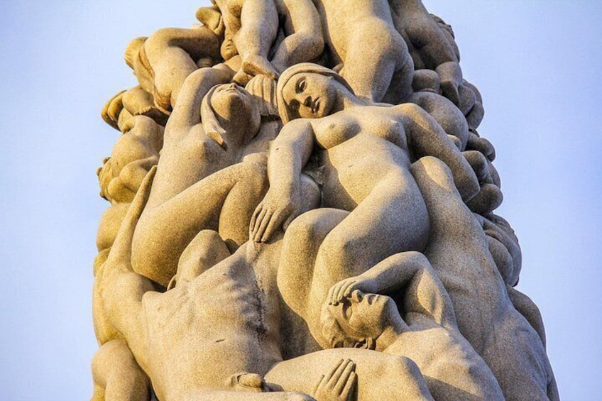 A large, detailed sculpture of multiple human figures in various poses, likely representing a historical or mythological scene. 5